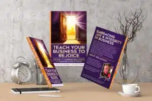 Books on business growth and leadership on a desk.